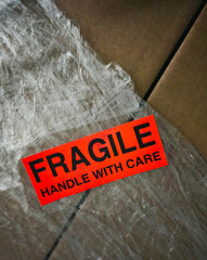 Moving boxes with fragile sticker on a background - 739460980