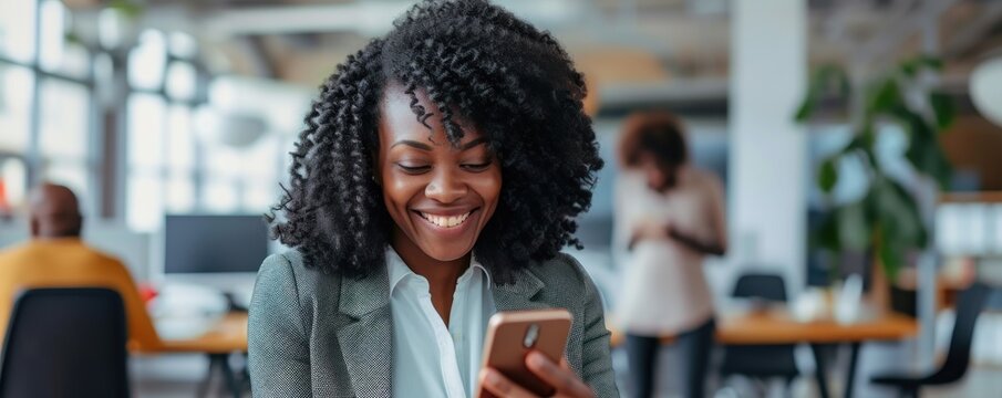 Happy africian woman using smartphone and smile.