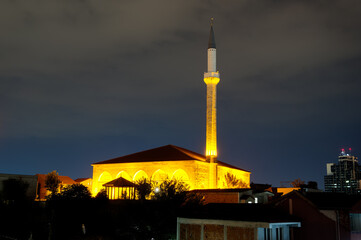 At the evening, above the rooftops, a view of Sultan Murati minaret in Skopje (Macedonia)