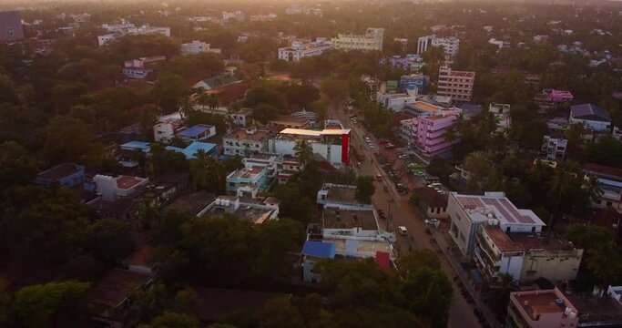 Drone view of Nagercoil town, Kanyakumari District showing cars on street, trees and buildings