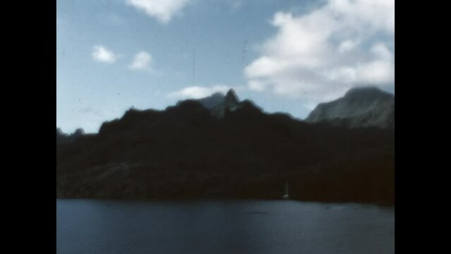 Mount Tohivea on Moorea Island 1971 - The camera zooms in on Mount Tohivea, an extinct volcano and the highest peak on the south Pacific island of Moorea, in French Polynesia, 1971. 