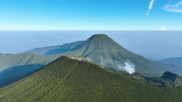 Aerial view of mountains under mist in the morning, Mt. Gede Pangrango view on Java Island. 
