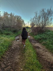 woman on a walk with her animals