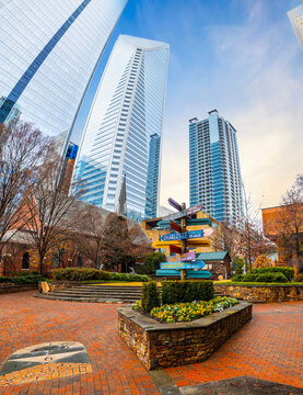 Colorful directions signs in Charlotte The Green city center park