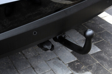 Towbar on a car. Car hook for draging. Black steel part. Car tow hitch.