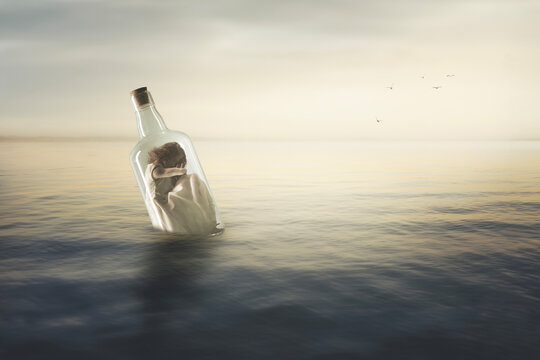 surreal bottle with a woman curled up at the mercy of the ocean inside, abstract concept