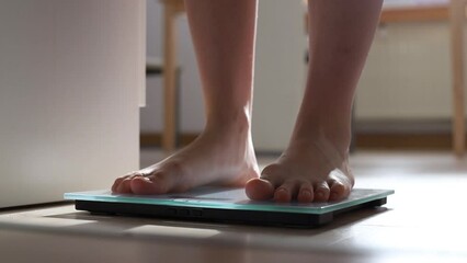 Woman On Scales Measure Weight.Human Barefoot Measuring Body Fat Overweight.Girl Legs Step On Scale.Close Up Woman Checking Diet Female Feet Standing Weighing Scales On Room - Powered by Adobe