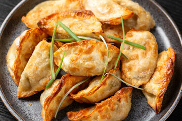 Crispy fried dumplings Gyoza with vegetables. Asian food.