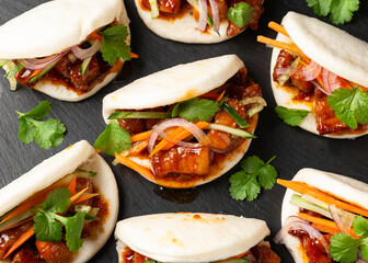 Bao buns with pork belly and vegetable. Asian cuisine