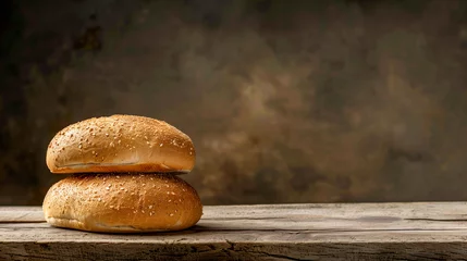 Poster Two sesame seed bagels stacked on a rustic wooden surface © Natalya
