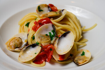 Spaghetti alle Vongole Italian or Venetian Clam Pasta with White Wine, Tomatoes and Parsley
