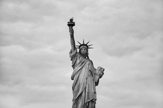 Statue of Liberty on the background of sky, New York City.  Black and white image.