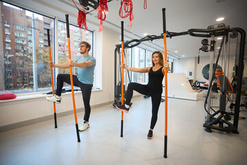 Clients of the rehabilitation center perform balance exercises - obrazy, fototapety, plakaty
