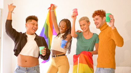 Multiethnic gay and lesbian friends partying with a lgbt flag