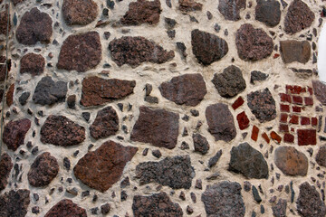 Fototapeta premium old stone wall, cement, red cobblestones, texture, vintage background