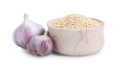 Dehydrated garlic granules in bowl and fresh bulbs isolated on white