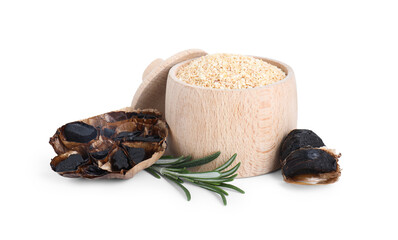 Dehydrated garlic granules, fermented black garlic and rosemary isolated on white