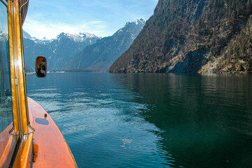  Boat on the lake. Beautiful landscape of the lake and mountains. Sailing between snow-capped...