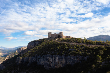 Fototapeta na wymiar View of the castle of Chirel located on top of a hill on a sunny day. Cortes de Pallas - Valencia - Spain