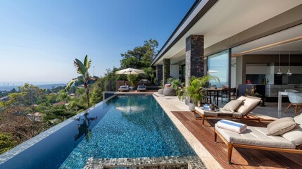 Luxurious home with an open plan living area leading to a beautiful pool with a great view