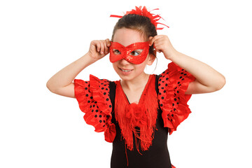 A little girl in a red Spanish dress and a carnival mask. Purim.