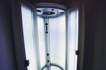 Vertical Tanning turbo Solarium Light Machine with glowing blue light ultraviolet lamps for tanning...