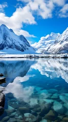 Fotobehang Tranquil Arctic Landscape: The Majestic Beauty of a Snow Covered Fjord Under a Crisp Blue Sky © Curtis