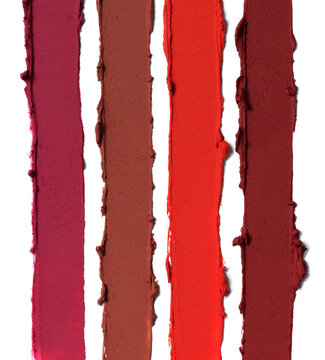 Pink red matte lipstick striped texture background composition. Cosmetic product smear smudge swatch