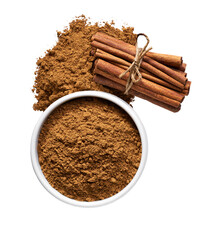 cinnamon sticks and  ceramic bowl with cinnamon powder isolated on a white background, top view.
