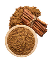 cinnamon sticks and wooden bowl with cinnamon powder isolated on a white background, top view.
