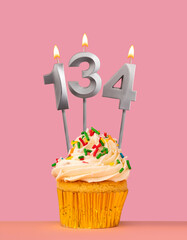 Birthday card with cupcake and candle number 134