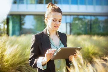 pensive modern woman employee near business center