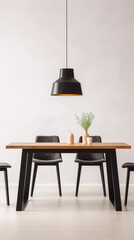 Black and brown wooden table and chairs with a black lamp above it.