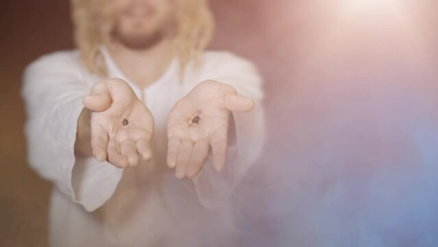 Jesus Christ shows scars on hands stigmata from wounds after crucifixion