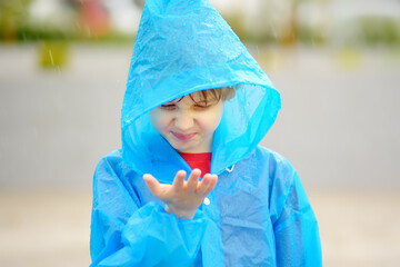 Portrait of a disgruntled child in the rain.