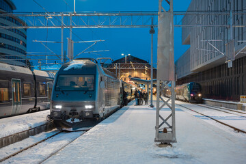 Trains waiting at Bergen train station in early morning ready to depart to the capital. People...