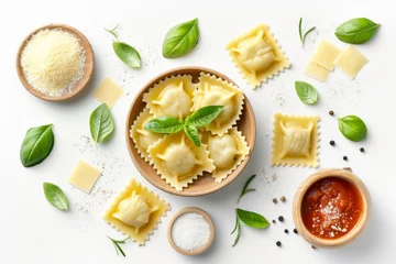 Fotobehang Italian ravioli pasta filled with spinach and ricotta served with tomato sauce parmesan and basil leaf Isolated on white viewed from above © The Big L