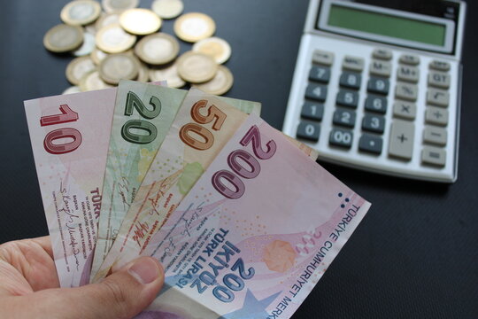 man counting Turkish money with his hand. Turkish lira banknotes. The paper currency of Turkey. For tax and hike news.