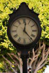 Fototapeta na wymiar Afternoon view of a historic clock in downtown Tustin, California, USA.