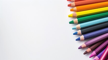 Fototapeta premium Colored pencils lined up on white background