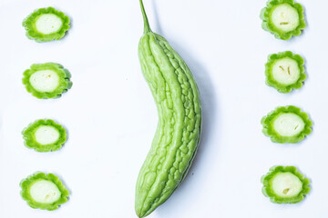 Beautiful arrangement of Chinese Bitter gourd or Bitter melon on a white background with soft...