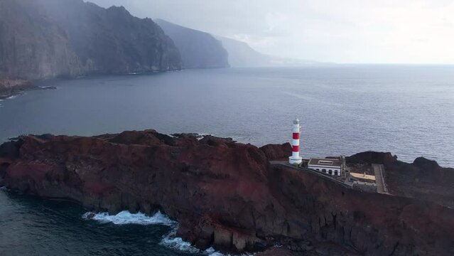 Drone view of Lighthouse Punta Teno on the ocean. Volcanic cliffs of Tenerife, Canary island