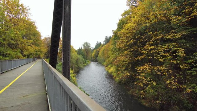 A view of a walking bridge on an Autumn day in Renton, Washington. 