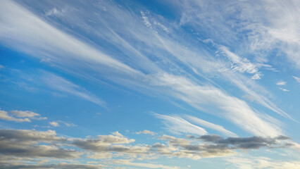 WIspy clouds and blue sky suitable for background