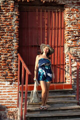 Beautiful woman wearing the traditional Colombian hat called Sombrero Vueltiao at San Ignacio Bulwark in the historical Cartagena de Indias walled city
