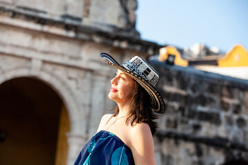 Beautiful woman wearing the traditional Colombian hat called Sombrero Vueltiao at the Peace Square...