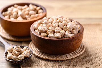 Organic dried chickpea in wooden bowl with spoon, Healthy food ingredient