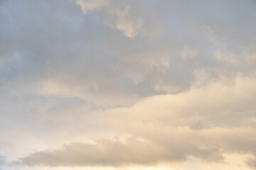 Dramatic stormy sky in evening light as the sun is setting, as a nature background
