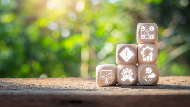 Outsourcing concept, Wooden block on desk with outsourcing icon on virtual screen.