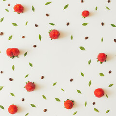 Colourful bright pattern made of strawberries, coffee beans and leaves.